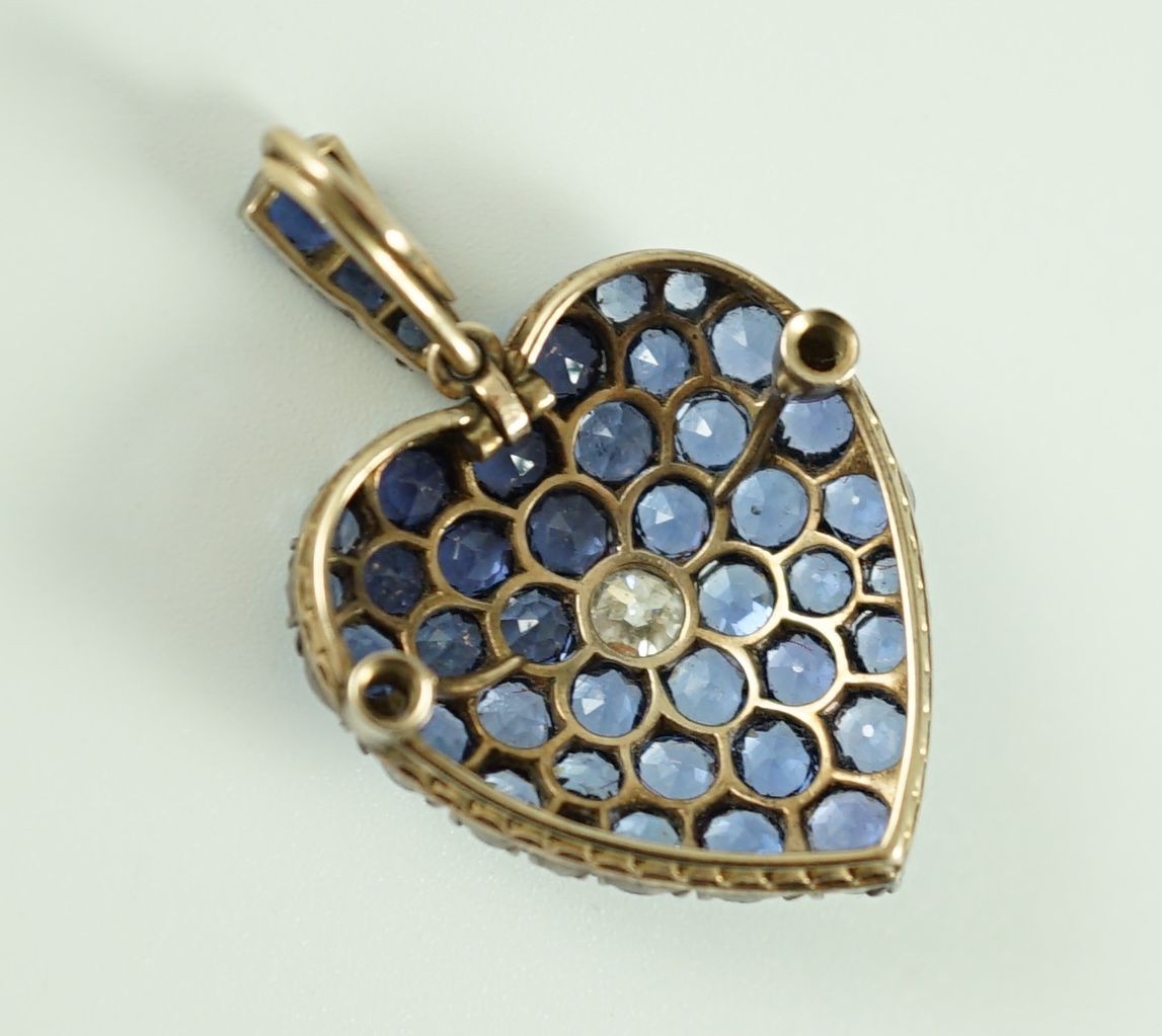 A late 19th/early 20th century gold and silver, sapphire and diamond heart shaped cluster pendant